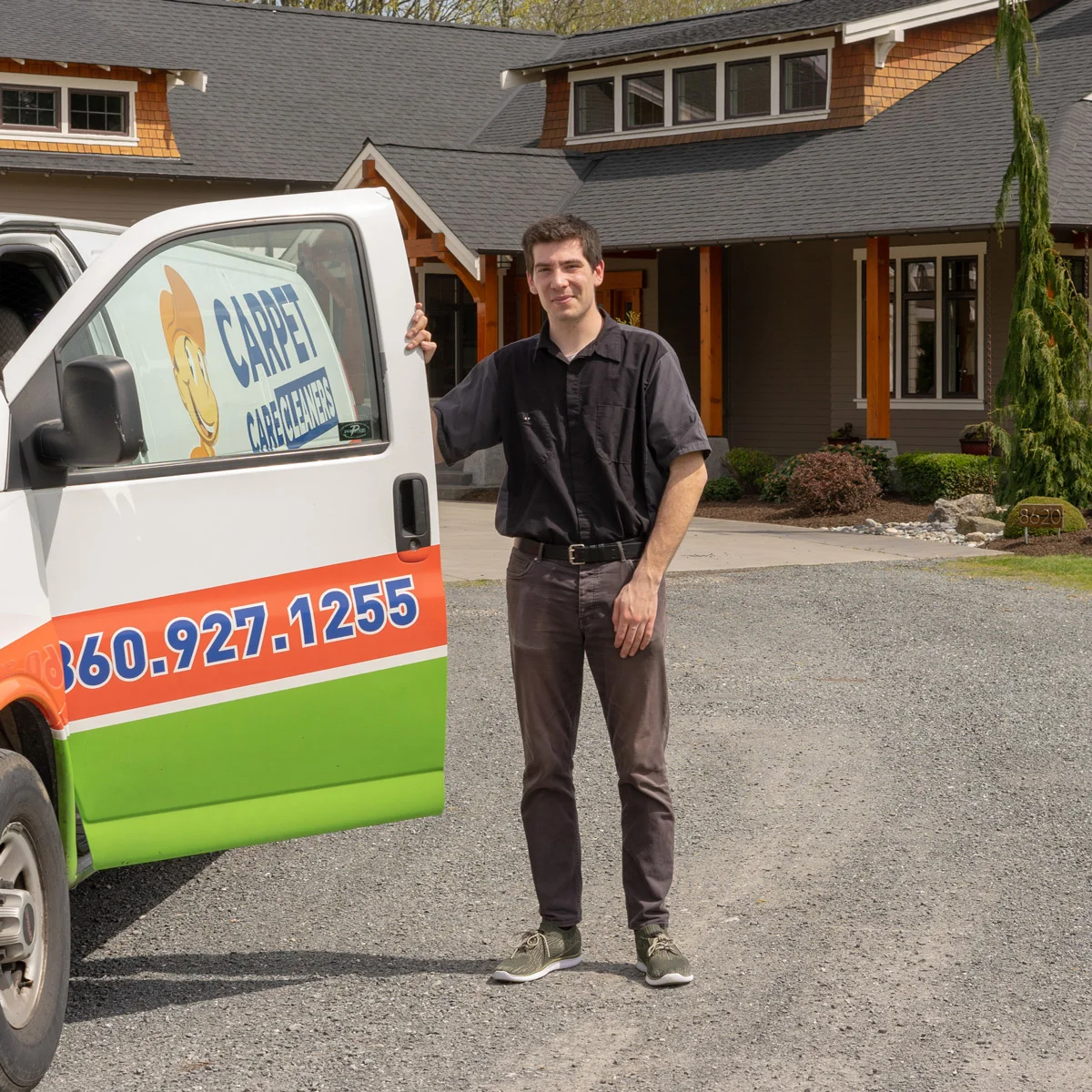 Carpet Care Cleaners technician beside the company van