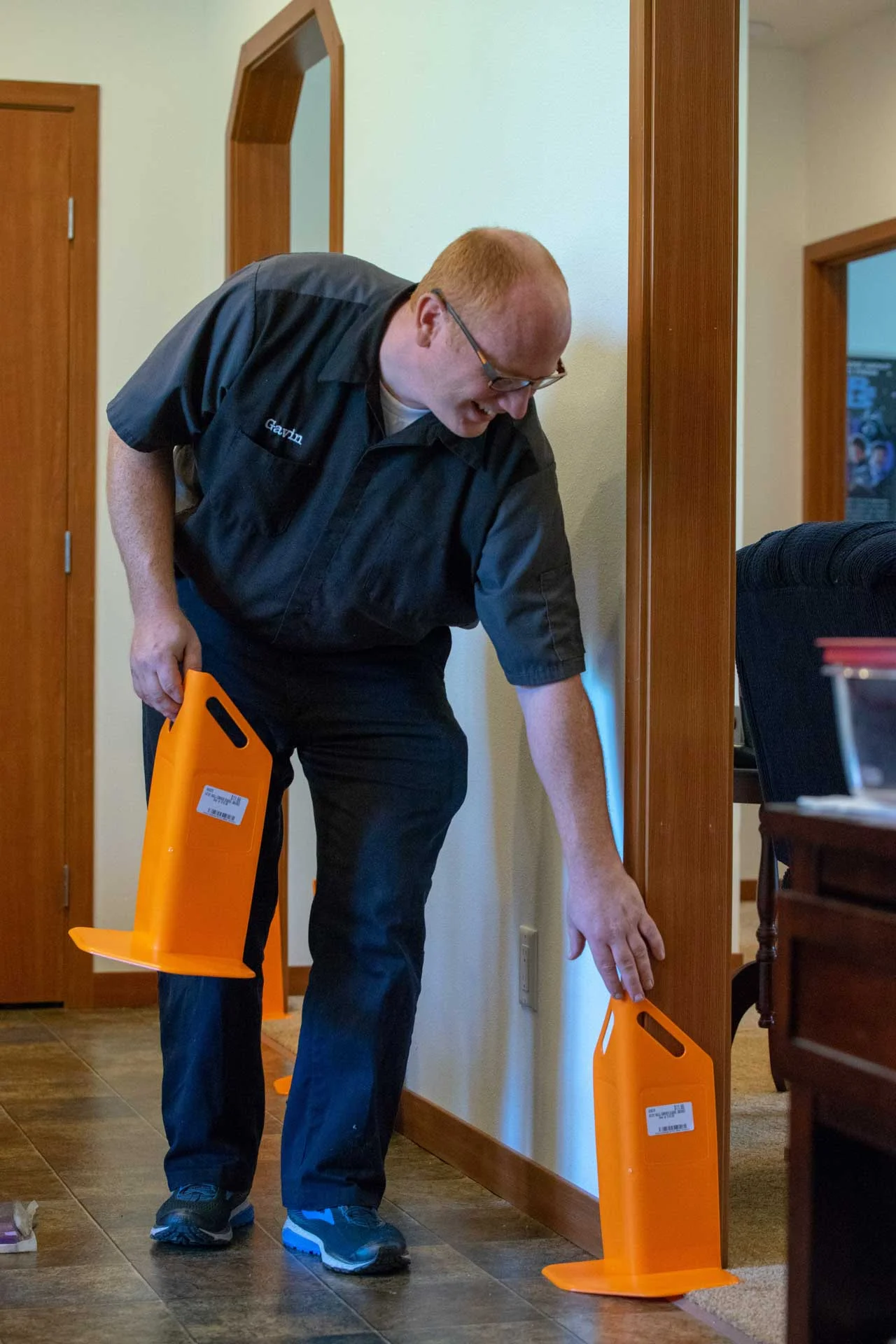 Gavin placing furniture protection blocks before cleaning